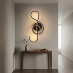 Nordic Music-Note LED Wall Sconce in black on a hallway wall