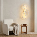 Nordic Music-Note LED Wall Sconce in white in a reading corner