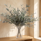 Close-up of realistic muted-green olive leaves on a faux stem