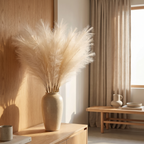 Bundle of fluffy artificial pampas stems against a warm neutral wall