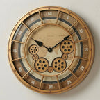Three-quarter angle of the golden world-map gear wall clock showing its frame depth