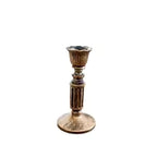 Style 1 vintage bronze taper candle holder shown against a neutral studio backdrop