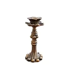 Style 2 vintage bronze taper candle holder shown against a neutral studio backdrop
