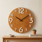 Oak-finish Nordic wall clock with white numerals and black hands above an entryway console
