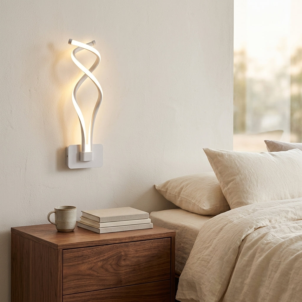 Nordic Twisted-Ribbon LED Wall Sconce in white above a bedside nightstand
