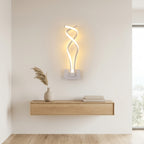 Nordic Twisted-Ribbon LED Wall Sconce in white above a console shelf