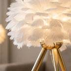 Nordic feather table lamp on minimal walnut desk workspace