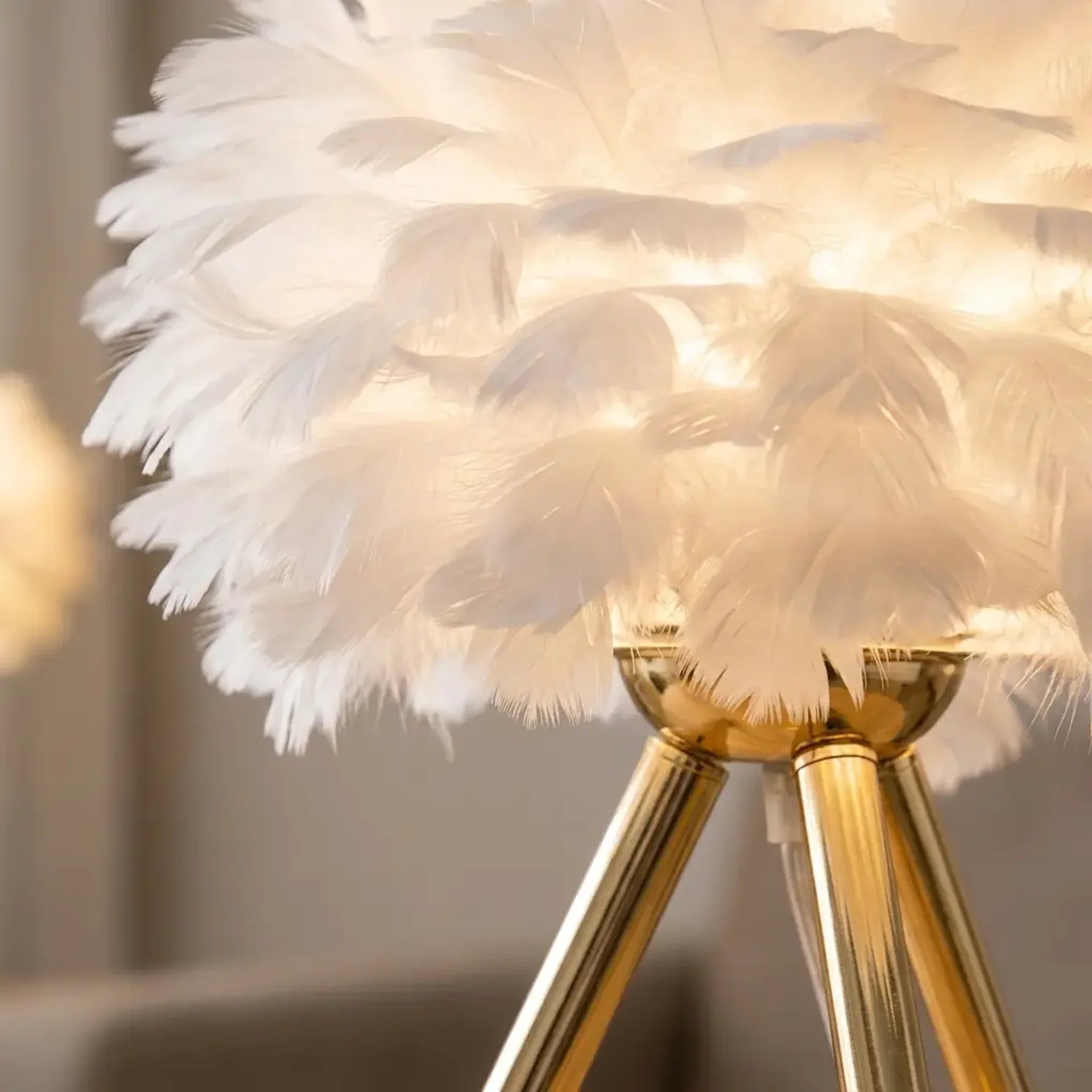 Nordic feather table lamp on minimal walnut desk workspace
