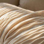 Close-up of the pleated ribbed velvet texture and fine metallic silver stripe detail