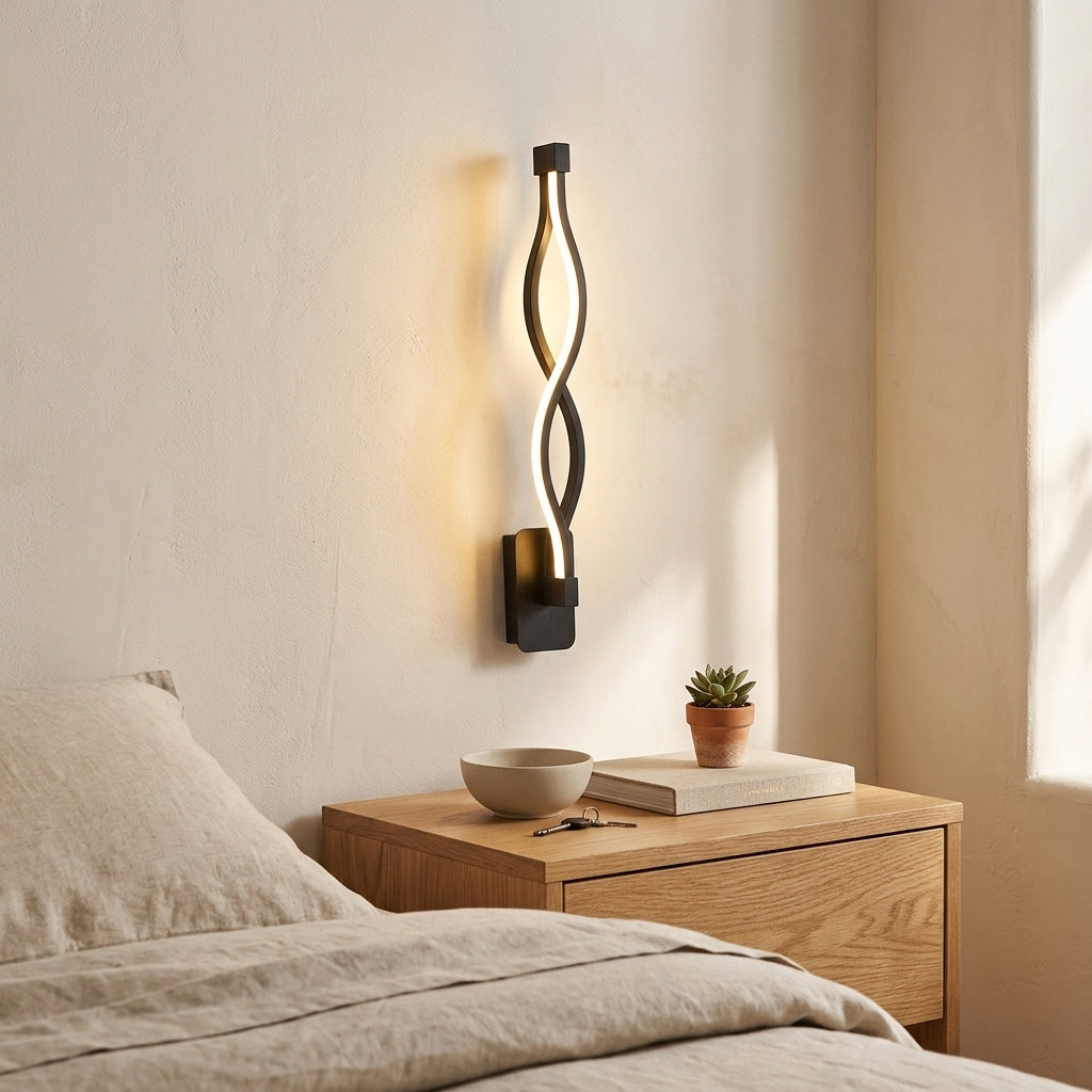 Nordic Wave LED Wall Sconce in black above a bedside nightstand