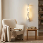 Nordic Wave LED Wall Sconce in white in a reading nook
