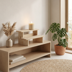 Minimalist wood riser lifting a ceramic vase on an open shelf