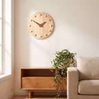 Natural wood Nordic wall clock with wooden ball markers on a warm living room wall